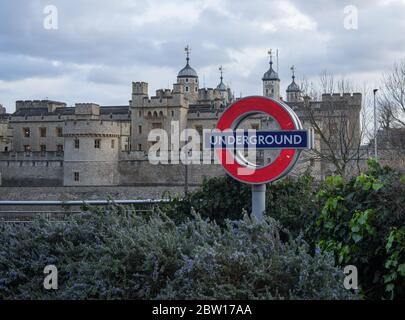 London Underground roundel sign with the Tower of London in the background. Stock Photo