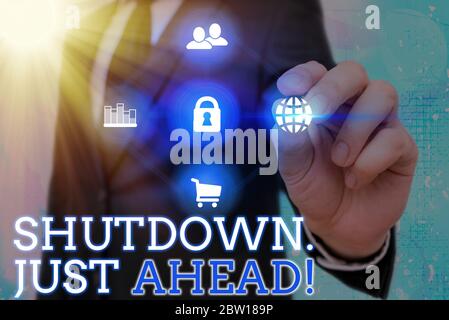 Writing note showing Shutdown Just Ahead. Business concept for closing factory business either short time or forever Stock Photo