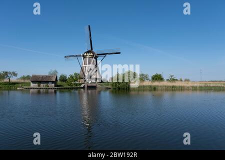 Netherlands rural lanscape with windmills at famous tourist site Kinderdijk in Holland. Unesco site. Stock Photo
