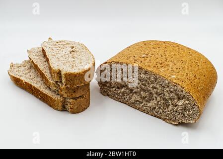 Slices of wholemeal bread isolated on white background Stock Photo