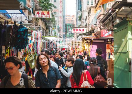 Hong Kong - November, 2019: Crowd of asian people on street market in Hong Kong, China Stock Photo