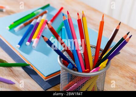 Colored pencils kept in pencil holder Stock Photo