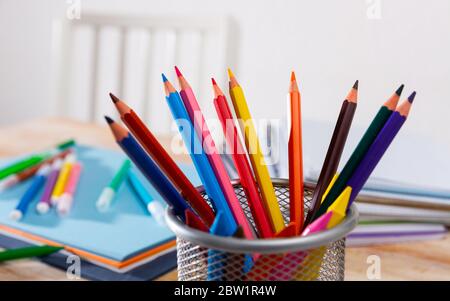 Concept of preparation for school. Different school supplies on the table Stock Photo