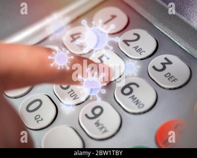 Finger pressing on number button on ATM machine with virus floating around. Virus infection spread disease concept. Stock Photo