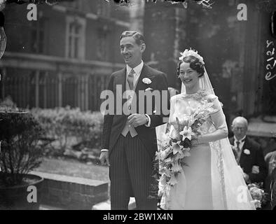 Sunny smiles at June wedding. Married at the same time as Duke of Windsor. London wedding rush. Photo shows: Mr William Earl Belgrave of Gloucester and Miss Freda Margaret Smyth of St John's Hill, Salthead, smiling as they left in the June sun after their wedding at the Savoy Chapel, Strand, London. 3 June 1937 Stock Photo