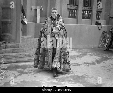 Bishop of Norwich at final Coronation rehearsal. Photo shows: the Bishop of Norwich, in his robes, as he left Westminster Abbey after attending the final rehearsal of the Coronation ceremony. 10 May 1937 Stock Photo