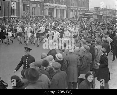 Police compete in Barking to Southend walk. Police athletes started from Barking police station on their annual Barking to Southend walk. Photo shows the start. 29 April 1937 Stock Photo