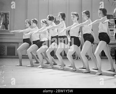 Canadian health and beauty girls rehearse in London. The 58 Canadian members of the Women's League of Health and Beauty who have come to London to participate in the League's great Coronation exhibition at Wembley on 12th of June, rehearsed at the Mertimer Hall, great Portland Street. The average age of the girls is 24. Most of them work in offices when they are at home. Photo shows, Canadian girls at the rehearsals. 7 June 1937 Stock Photo