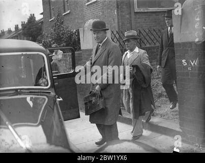 Man was arrested after the body of Daisy Vera Skeels, a 16-year-old waitress has been exhumed, for an inquest. William Henry Skeels, brother of the dead girl, accused Andrew Chumley who was taken into custody on the coroners warrant on the charge of manslaughter. Photo shows: Andrew Chumley, leaving the court after the inquest at Hounslow, London. 18 June 1937 Stock Photo