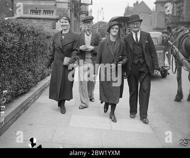 Man was arrested after the body of Daisy Vera Skeels, a 16-year-old waitress has been exhumed, for an inquest. Andrew Chumley was taken into custody on the coroners warrant on the charge of manslaughter. Photo shows: the parents of the victim Mr and Mrs William Skeels and their daughter, Edith with partner Leslie Hughes leaving after giving evidence at the inquest at Hounslow, London. 18 June 1937 Stock Photo