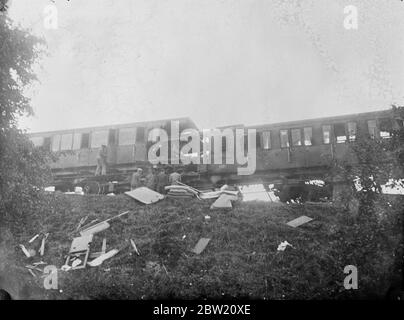 9 people were killed and 27 injured when two trains collided at a level crossing a mile from Le Mans Station, France. The wrecked coaches of the train in which the majority of the dead were travelling. 10 July 1937 Stock Photo