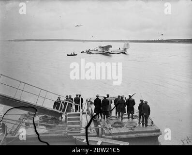 Cheering crowds. The Clipper landing on sea. Comander, Captain Harold E Gray and members of they crew of the clipper. as it landed at Foynes air base after a historic flight in 12 hours and 40 minutes. In which the British flying boat inaugurated the transatlantic 's experimental service. 6 July 1937. Stock Photo