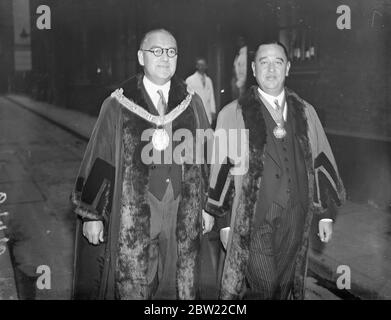 Mr J.E Gardner, the new master (right) walking in the procession with Mr Waters, retiring master. Following the installation of the new master members of the ancient Inn holder's company walked in procession from companies Hall into college Street to St Michael Royal church, College Hill, city the customary service. The Inn holders was founded in the early part of the 13th century. 5 October 1937. Stock Photo