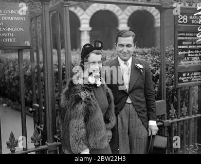 Dressed entirely in black, Miss Margaret Gill of Adelaide, South Australia, was married to the Marloes Road Registry officer, Kensington, to Mr Norman Alexander of London. Miss Gill chose black because she thinks is the proper thing to wear in town. 6 October 1937. Stock Photo