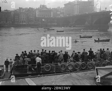 The start of the race from London Bridge of the 223rd annual sculling race , the Doggett's Coat and Badge , which takes place over a 4 mile course from London Bridge to Chelsea Bridge. The contest was started in 1715 by Thomas Doggett who offered the prize to commemorate the accession of King George I. The winner of the race receives a red coat with a the silver badge on the left arm. 23 July 1937. Stock Photo