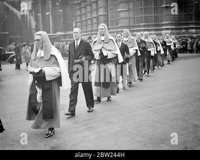 Following a service at Westminster Abbey on the occasion of the reopening of the Law Courts, the Judges, attended by members of the bar, walked in procession to the Palace of Westminster, where they were received by Lord Maugham, the Lord Chancellor, in his private apartment. There was then entertained to Breakfast with other distinguished guests. The Breakfast was received this year after a lapse of seven years on economic grounds. Photo shows: Judges in the procession from Westminster Abbey. 12 October 1938 Stock Photo