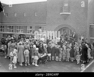 120 Southall children in 'school strike'. Although the new term was due to begin, there was no school for 120 children living at the Lady Margaret estate, Southall, Middlesex, their parents having decided on a 'school strike' as a protest against transference of all pupils between seven and 11 years old, from North Road school to Tudor Road school. This change means a walk of more than a quarter of an hour instead of about eight minutes. Mothers took their children to the new Lady Margaret School on the estate and demanded admission for the children., Photo shows, mothers and children locked o Stock Photo