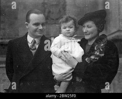 MPs baby daughter christened in House of Commons crypt. The baby daughter of Mr HW Butcher, MP for Holland with Boston (Lincs), and Mrs Butcher, was christened in the Crypt Chapel at the House of Commons. The baby was given the names joy Daphne. Photo shows, Mr and Mrs H W Butcher, leaving with the baby after the christening at the House of Commons. 27 January 1938 Stock Photo