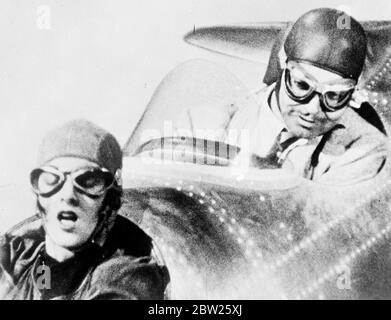 Air courtship, on the studio floor. This series of pictures shows the whirlwind courtship in the cockpit of a plane of Myrna Loy and Clark Gable, daredevil test pilot, introduces himself to Myrna Loy , when he forced lands is plane in a field. The plane is supposed to be a mile high as Gable gives Myrna Loy a flying lesson, but the shots were made in a special machine on the studio floor. Photo shows, Myrna Loy gives a great job of relief as Gable pulls the plane out of the dive. Stock Photo