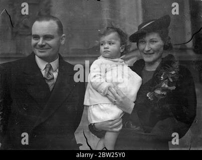 MPs baby daughter christened in House of Commons crypt. The baby daughter of Mr HW Butcher, MP for Holland with Boston (Lincs), and Mrs Butcher, was christened in the Crypt Chapel at the House of Commons. The baby was given the names joy Daphne. Photo shows, Mr H W Butcher, MP, and Mrs Baker, leaving with the baby after the christening at the House of Commons. 27 January 1938 Stock Photo