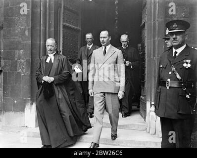 Duke of Gloucester sees stained glass window to father in Winchester. Breaking his tour of Boys Clubs in the Hampshire district the Duke of Gloucester visited Winchester Cathedral to ispect the stained glass windows presented by Americans as a tribute to his father, King George V. The Duke was making his tour as President of the National Association of Boys Clubs. Photo shows, The Duke of Gloucester leaving the Cathedral with the Dean. 25 July 1938 Stock Photo