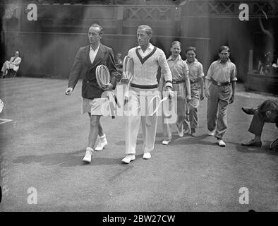 McGrath and pallada meet on Centre Court at Wimbledon. Vivian McGrath of Australia, and Josip Palada of Yugoslavia met in the third round of the men's singles on the Centre Court at Wimbledon. Photo shows, McGrath (left) and Pallada walking onto the court. 24 June 1937 Stock Photo