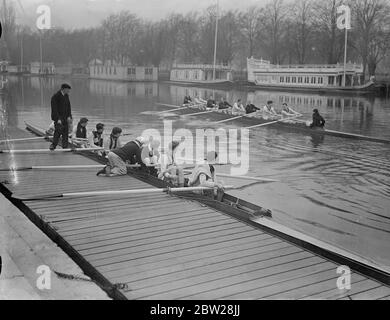 Oxford crews have first practice for boat race. Nearly a week after their rivals, the Oxford's eight went out on the Isis for their first practice for the inter-University boat race on 2 April. Photo shows, one of the trial eights at practice on the Isis watched by the other crew, which is about to push away. 10 January 1938 Stock Photo