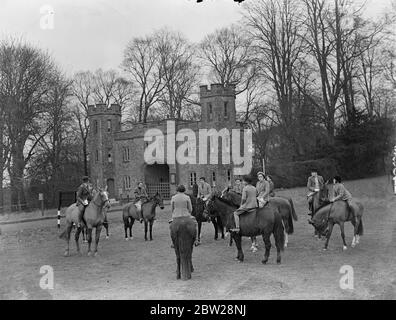 Pony rally with Arundel Castle as background. Against the picturesque background of Arundel Castle, ancestral Sussex home of the Duke of Norfolk, the Cowdrey Pony Club held a Pony Rally on Whiteway's Common for children. These rallies are given to teach children Hunt etiquette. Photo shows, the children's Pony Rally on Whiteway's Common, near Arundel, Sussex. In background is seen the Gateway of Arundel Castle. 29 December 1937 Stock Photo