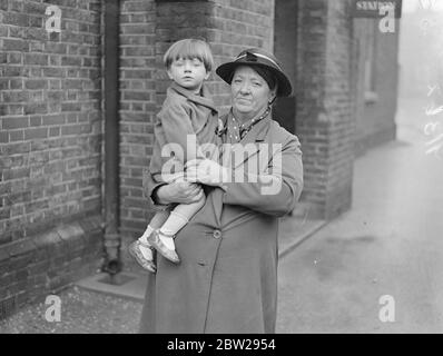 London woman has baby left on her hands by a girl she befriended. Left with a 14 month old baby and no trace of his parents, is the predicament in which grey-haired Mrs Florence Smith, of Westway, at Shepherd's Bush, has found herself. Mrs Smith, who already has four children of Rome, befriended two weeks ago, Mrs Lillian Evans, a young mother who came to her door asking for help, and promised to take care of her until she got work. On Saturday, Mrs Evans dressed and went out, leaving her baby, Derek, asleep in his cot. Since then, her benefactor has been unable to trace her. The baby is now b Stock Photo