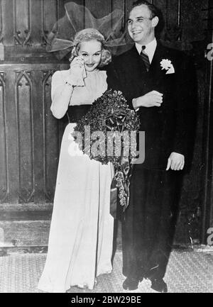 Jackie Coogan's bride cried for joy!. After a three-year courtship, Jackie Coogan, who achieved fame and fortune as a child actor, and Betty Grable, blonde film actress, were married at St Brendan's Catholic Church in Hollywood. The couple went to Palm springs, California, for a short honeymoon. Photo shows, Betty Grable dried her tears of joy as she left the church with happy Jackie Coogan, after their wedding. 29 November 1937 Stock Photo