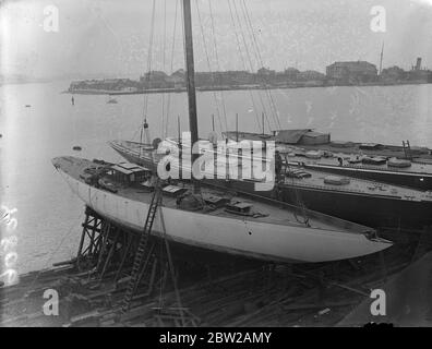 Big yachts laid up at Gosport for the winter. Britain's big 'J' class racing yachts are now laid up for the winter at the Gosport (Hampshire), yards. Photo shows, the big yachts at Gosport. Left-to-right, Candida , Endeavour I, Endeavour II and Valsheda 2 November 1937 Stock Photo