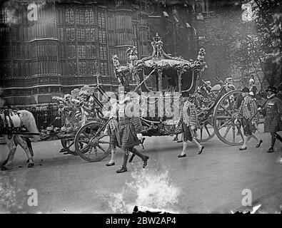 King and Queen drive in State to Opening of Parliament. In a full State procession, the first since the 1933 ceremony, the King and Queen left Buckingham Palace to Open Parliament for the first time in their reign. Photo shows, the King and Queen in the State Coach on their way to the Houses of Parliament.. 26 October 1937 Stock Photo