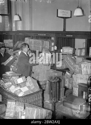 China-Japan 'sort out' at Mount Pleasant. Parcels destined for China and Japan, passing through the methodical hands of the sorters at Mount Pleasant, London, who show that there is at least one Sino Jap muddle which can be easily straightened out. The seems to be a certain optimism on the part of the senders of the parcels, considering that human life in the far east is at a discount just at present. 4 November 1937 Stock Photo