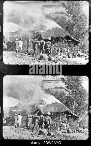 Dessie / Dese / Dessye was first bombed 6 December 1935, during the Italian invasion of Abyssinia. The American Hospital was one of the buildings damaged in the attack [a local hut burning] 6 December 1935 abyssinian / ethiopian crisis Stock Photo