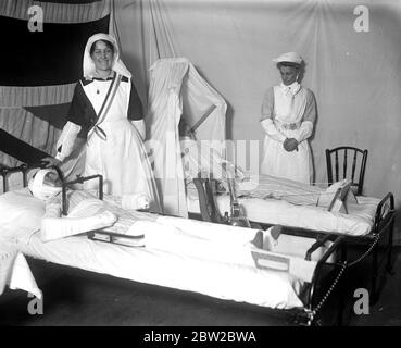 Exhibition of work done by the Wimbledon Women War Workers Depot. The model ward showing dummy 'wounded' in beds fitted with rests and appliances some of which were invented by this particular depot. 14 March 1917 Stock Photo