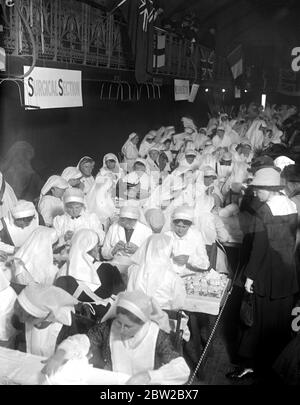 Exhibition of work done by the Wimbledon Women War Workers Depot. The needlework section. 14 March 1917 Stock Photo