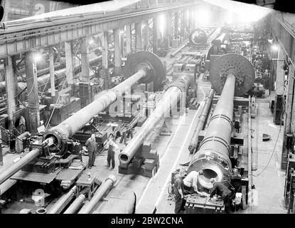 Where Britain forges victory. This pictures were taken in a Royal Ordinance factory of the Ministry of Supply where, thousands of workers are producing arms and ammunition which will help to ensure the victory of Britain and her Allies. Photo shows a general view of the big guns shop. 13 November 1939 Stock Photo