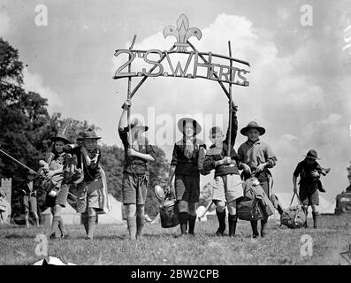 The County of Hertfordshire Boy Scout Rally is taking place in Hatfield Park over the weekend. Photo shows: Boys of the second South West Herts troop arrived with banners and baggage. 1 June 1939 Stock Photo