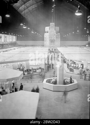 Radiolympia, Britain's biggest ever radio show, was opened at Olympia, London, for the first time by television. The first opening speech ever made to a public exhibition by television was delivered by Sir Stephen Tallents, BBC Public Relations chief, from Alexandra Palace. A general view of the show with a representation of Broadcasting House in background. 22 August 1939 Stock Photo