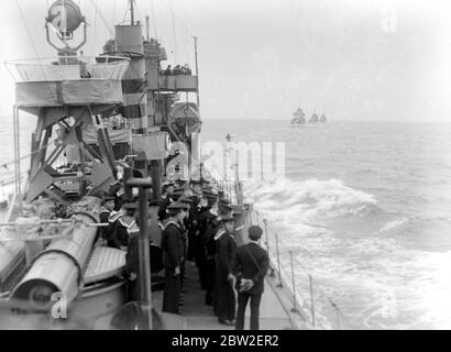 Home coming of Unknown Soldiers on H.M.S. Verdun on way home to England. Saluting the dead. After a 19-gun salute was fired from Dover Castle, she tied up at Admiralty Pier where General Sir John Longley supervised the six high ranking officers from the three Armed Services to bring ashore the coffin. Photo shows, home coming of Unknown Soldiers on H.M.S. Verdun on way home to England. 11 November 1920 Stock Photo