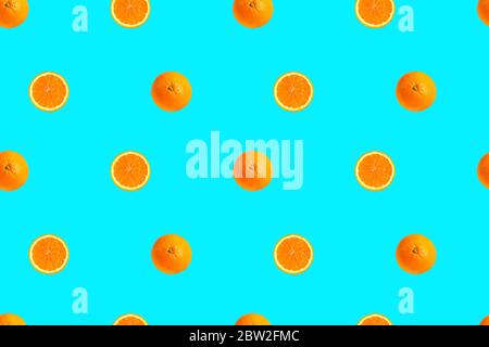 Oranges on bright light blue background seamless pattern. Stock Photo