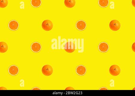 Oranges on bright yellow background seamless pattern. Stock Photo