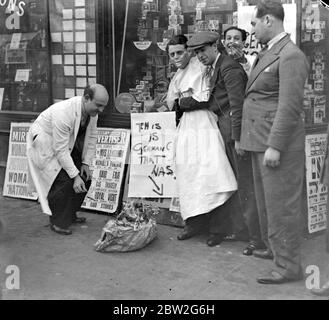 Jew Demonstration. Anti-German protest, showing amusement among the small group of onlookers. 1933 Stock Photo