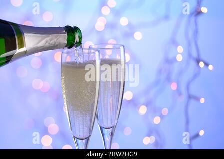 Champagne being poured into a champagne flute Stock Photo