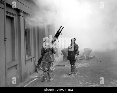 Air Raid precautions demonstrated by 1st Bn.Genadiers Guards and 1st Bn. Coldstream Guards at Wellington Barracks. Firefighting. 10 February 1938 Stock Photo