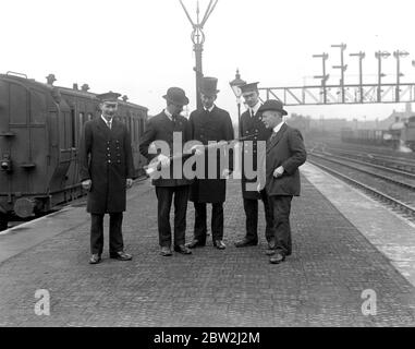 The Staff of Willesden Junction Station presented with a German Rifle in connection with The War Savings Scheme. Stock Photo