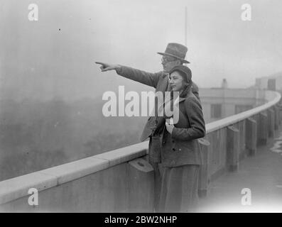 Prince Lennart and his bride in London . Prince Lennart of Sweden pointing out to his bride Miss Karen Nissvandt , various views of London from the roof of the hotel where they are staying pending their marriage at London register office . 24 February 1932 30s, 30's, 1930s, 1930's, thirties, nineteen thirties Stock Photo