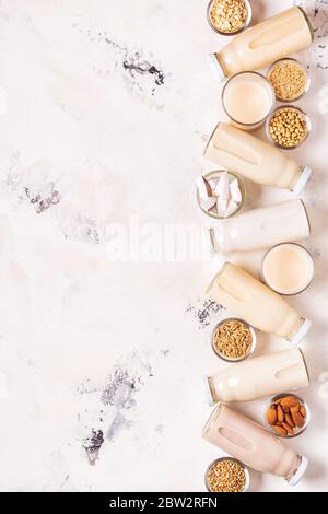 A bottles of alternative  milk and ingredients, top view. Stock Photo