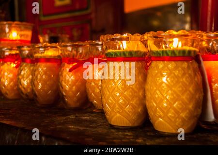 Pineapple in the local dialect sounds similar to safety which is why you see these candles at temples in Fuzhou Stock Photo