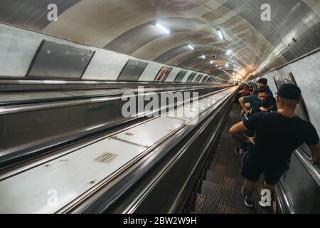 A long escalator down to the platform on the Tbilisi Metro, in Georgia's capital city Stock Photo